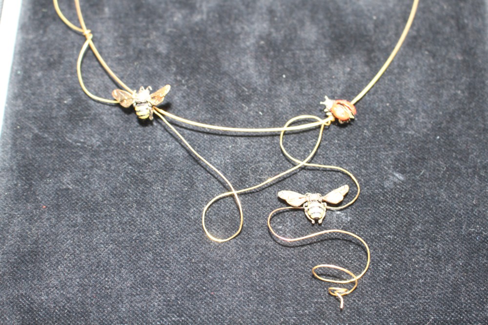 A modern 750 yellow metal ladybird and honeybee necklet, by Fanourakis, approx. 40cm, gross weight 9.5 grams.
